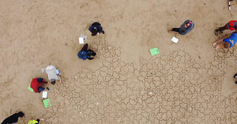 Members of the public joined mathematicians from Newcastle University to create what organisers believe is the largest aperiodic tiling ever attempted on Whitley Bay beach. Members of the public joined mathematicians from Newcastle University to create what organisers believe is the largest aperiodic tiling ever attempted on Whitley Bay beach.
