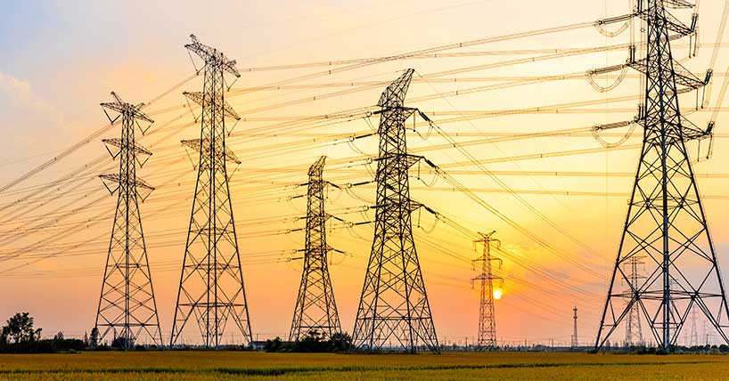 high-voltage power lines at sunset,high voltage electric transmission tower