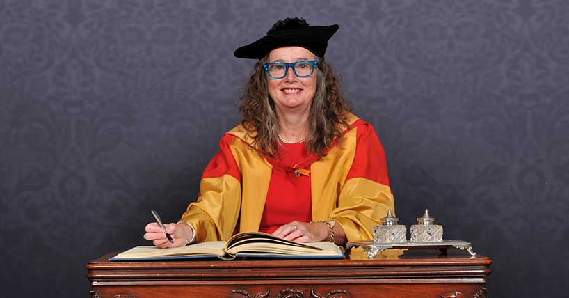 A photograph of Open Clasp artistic director Catrina McHugh at her Honorary degree