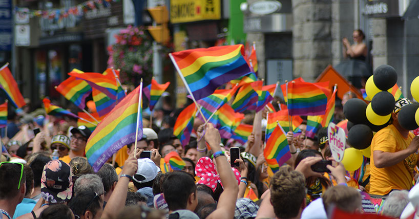 Pride march with rainbow flags