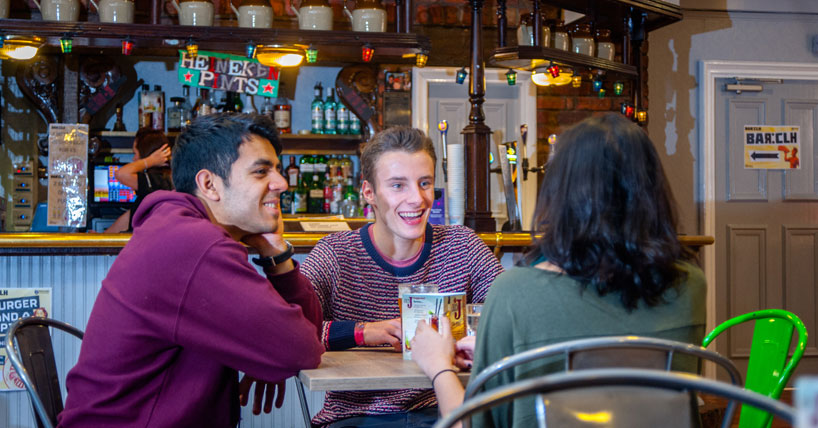 Three undergraduates in the Castle Leazes Bar