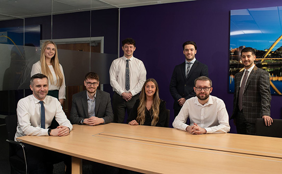 L-R: (standing) Newcastle University graduates Rachael Hara, Connor Lawson, Euan Morris and Daniel Harrison (sitting) Fairstone CTO Greg Horton, Newcastle University graduates George Bresland, Philippa Maw and Luke Urwin