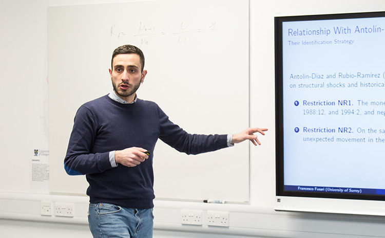 Francesco Fusari standing in front of an interactive whiteboard