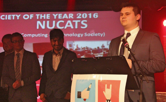 Chris Napier at a Newcastle University Students Union awards ceremony, accepting the 2016 Society of the Year Award for NUCATS.