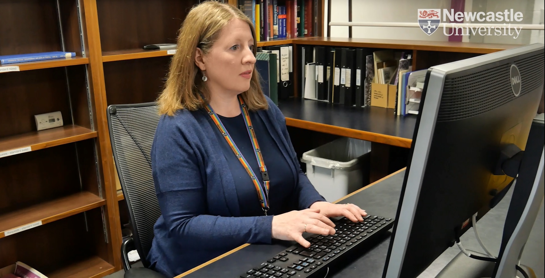 A woman sitting at a computer