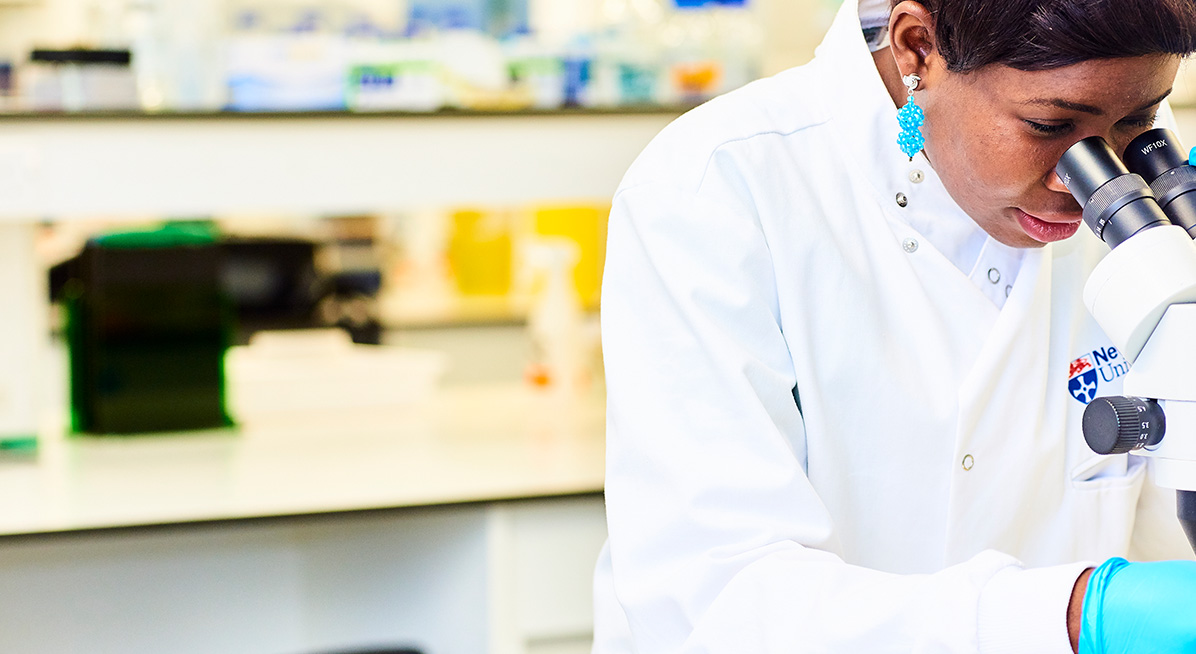 Biology student working in a lab